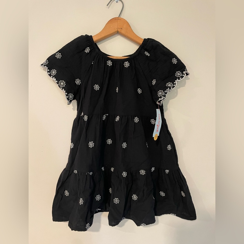 Black dress with white embroidered flowers. Size S (6/7)